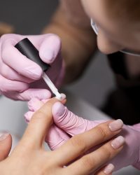 nail-art-professional-working-client-nails