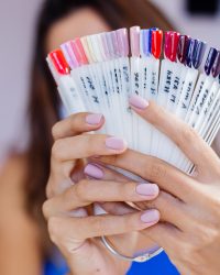 woman-protective-medical-mask-beauty-salon-hold-palette-select-color-manicure-procedure-nail-care-grand-opening-quarantine-is-small-businessess-are-open-again